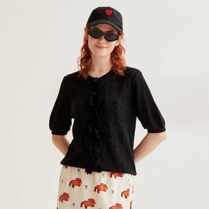 Cárdigan Compañía Fantástica punto floral negro con volantes